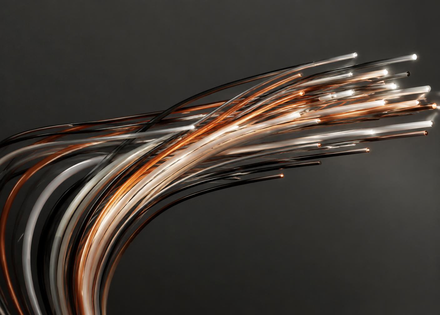 Bundle of fibre optic cables glowing in copper and white tones